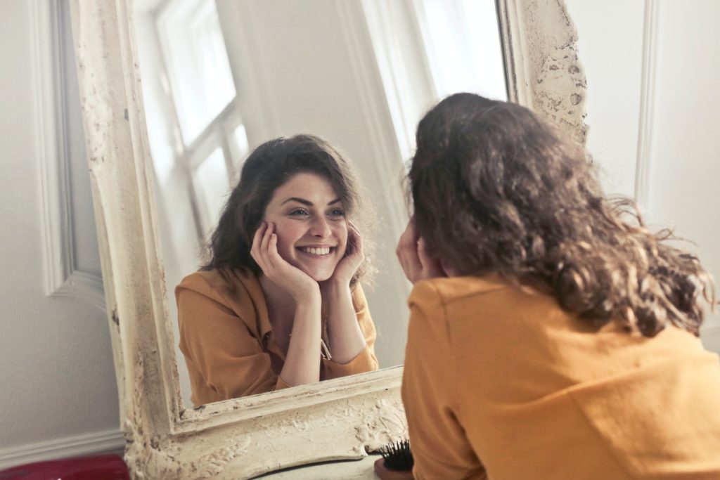 Woman celebrating her life now she has a been grasp of her self - esteem and body image
